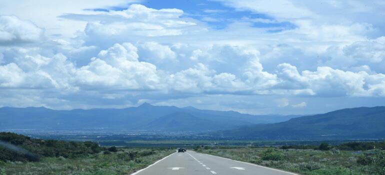 Scenic mountain road, ideal for long distance moving in Canada