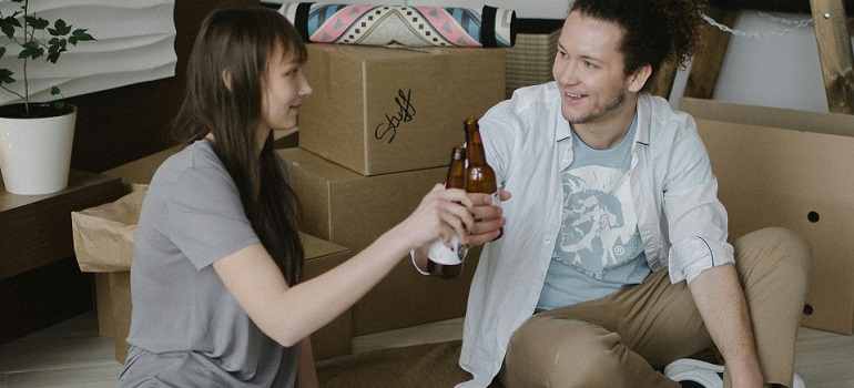 a couple toasting after a successful move