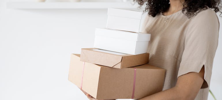 A woman holding boxes