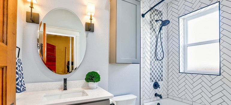 a bathroom of a someone who needs to learn about packing a mirror for a long distance move