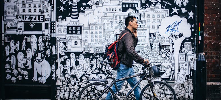 A man next to the street mural