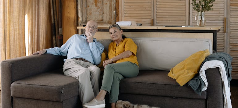A couple sitting on the sofa