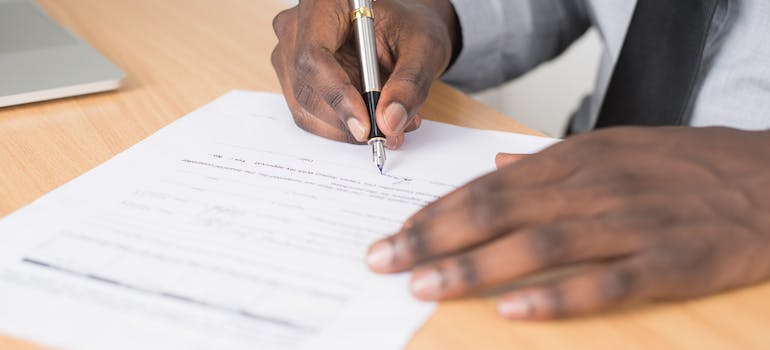 A person filling an application