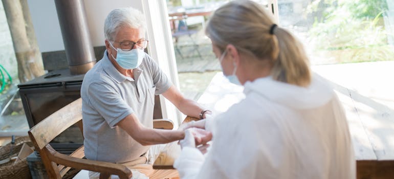 An elderly man and a doctor