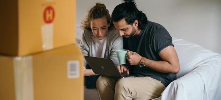 a couple working on subletting an apartment in Toronto