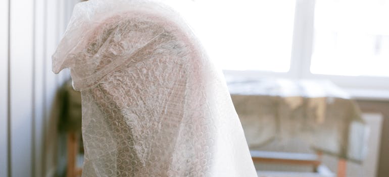 A chair wrapped with bubble wrap