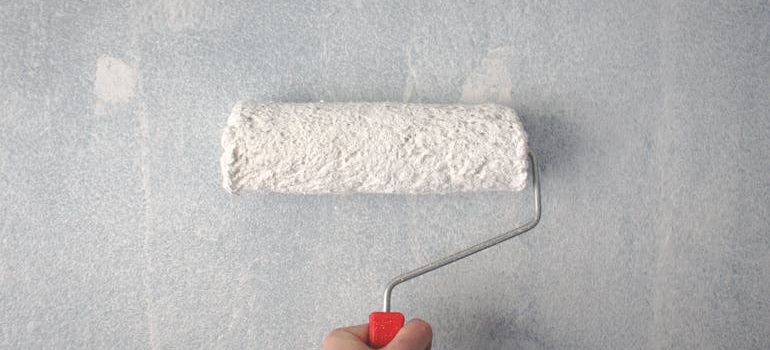 a man painting a wall