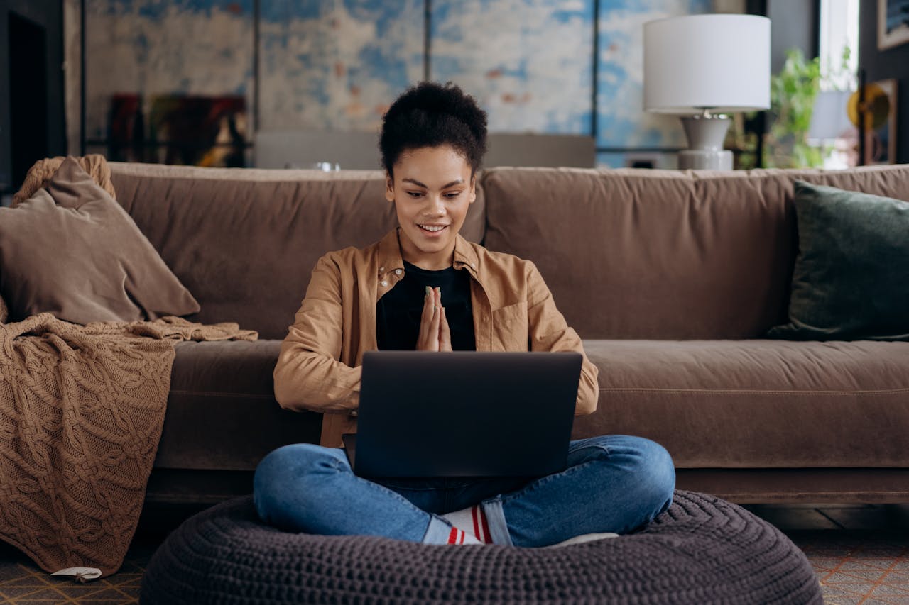 a girl looking at a laptop
