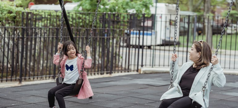 Mother and a daughter on the playground