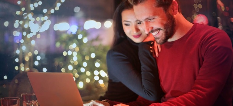 a couple using a laptop