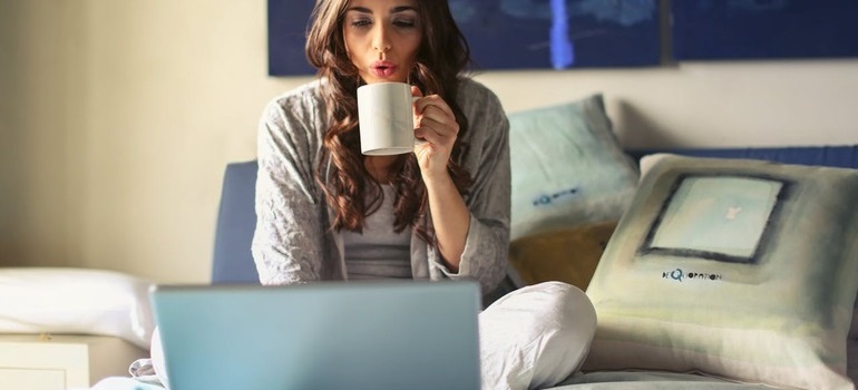 a woman using the services on one of the internet providers in Toronto