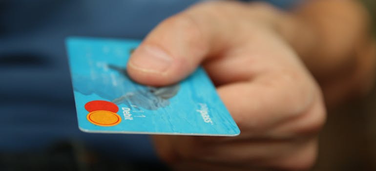 A person holding a credit card