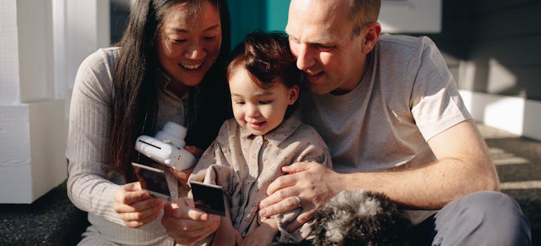 A family looking at the photo