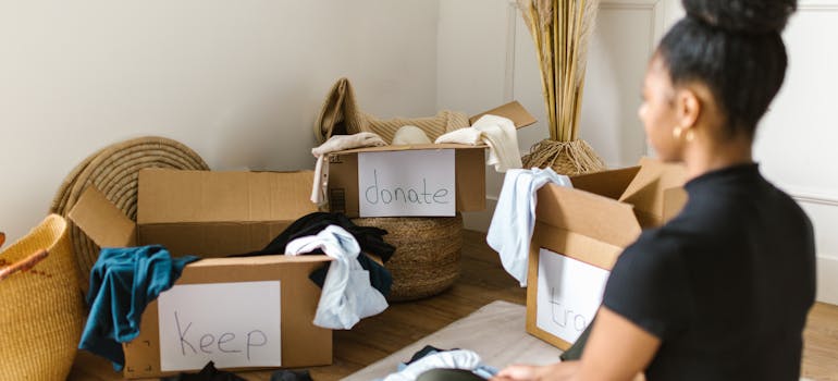 A woman decluttering in order to save money when moving