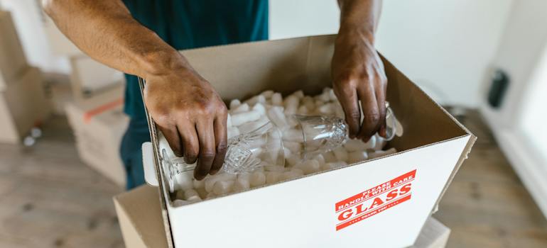 A person packing a glass
