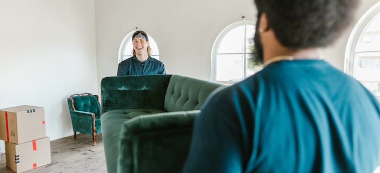 Movers carrying sofa