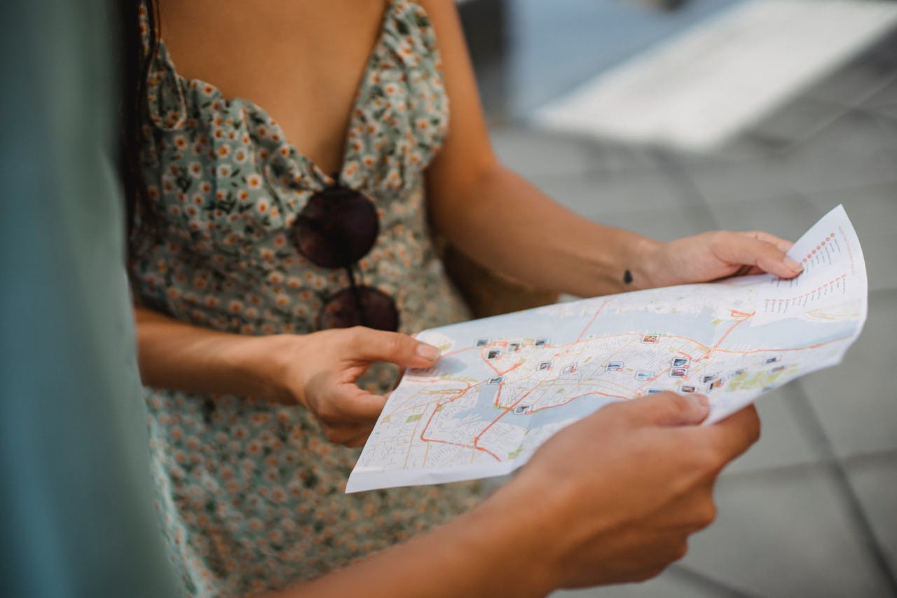A couple using a map to locate some of the best California cities for Torontonians