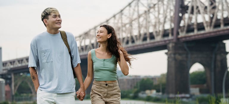 A couple holding hands in the park