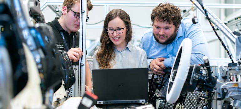 Three people trying to plan a tech lab relocation