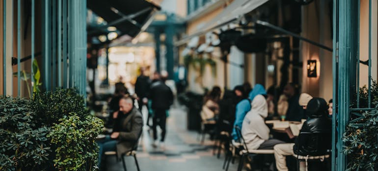 People in the restaurant with the outdoor tables